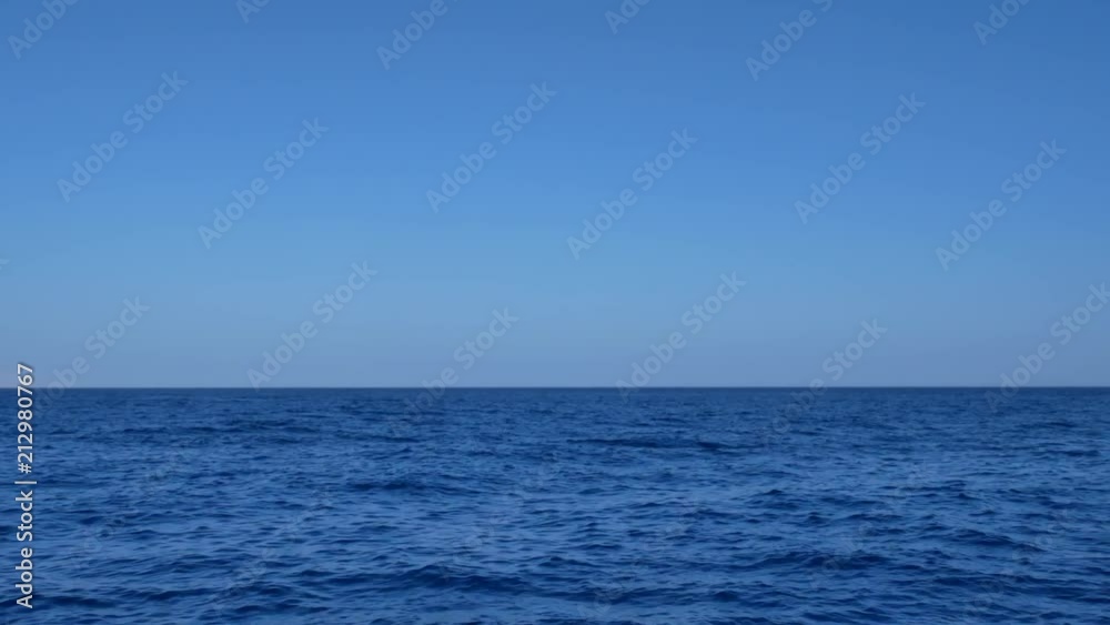 Blue transparent water surface on sea or ocean with small waves from the wind Blue transparent water surface on sea or ocean with small waves from the wind