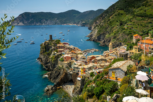 Horizontal View of the Town of Vernazza on blue Sea and the Coastline of the Liguria Background.