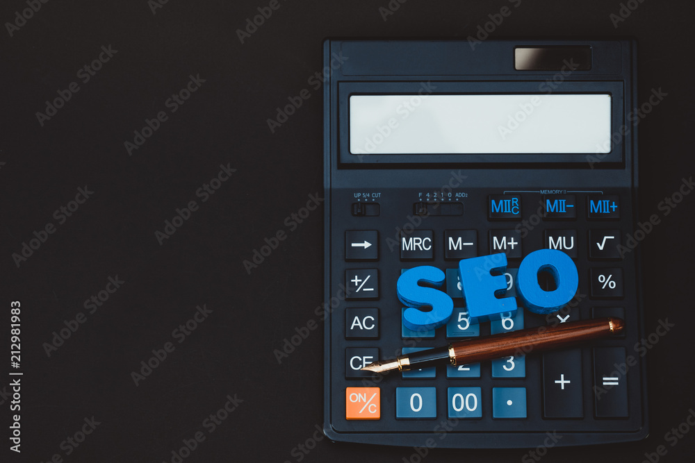 SEO text alphabet for Search Engine Optimization concept and Office supplies or office work essential tools or item calculator, business SEO idea. SEO text alphabet for Search Engine Optimization concept and Office supplies or office work essential tools or item calculator, business SEO idea.