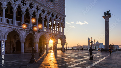 Sunrise in San Marco square, Venice, Italy. Venice Grand Canal. Architecture and landmarks of Venice. Venice postcard with Venice gondolas © daliu