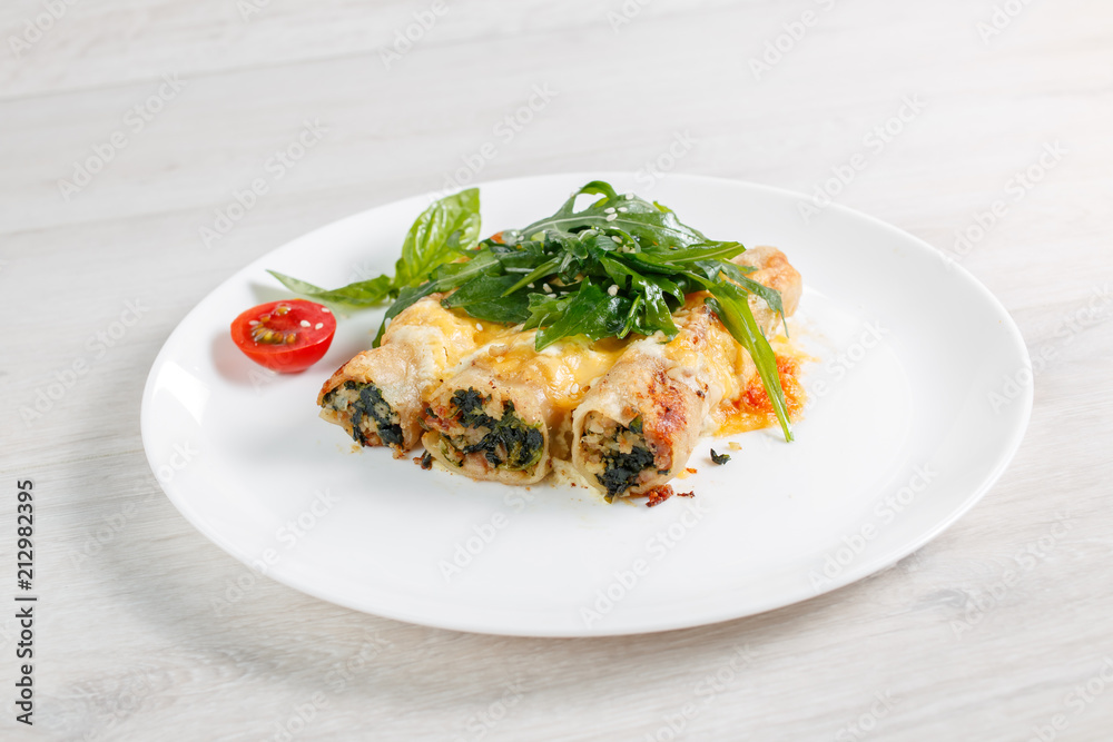 Cannelloni with spinach, cheese and bechamel sauce.