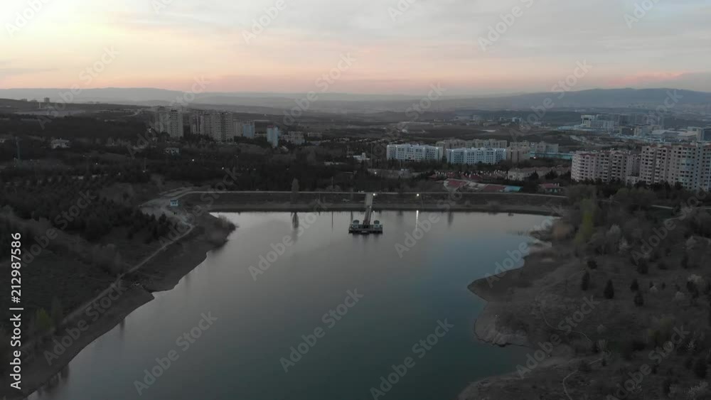 Various drone shots of a university campus, major building, reservoir and tracking cars. Various drone shots of a university campus, major building, reservoir and tracking cars.