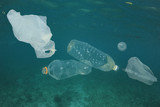 Plastic bags and bottles pollution underwater in ocean 