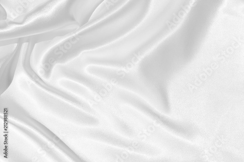 The texture of the satin fabric of white color for the background 