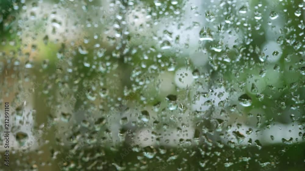 dolly shot, rain drops on glass window dolly shot, rain drops on glass window