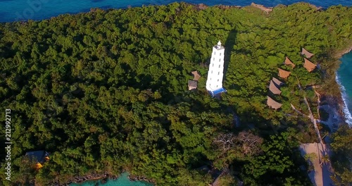 Aerial clip of the Chumbe Island, Zanzibar, with a close-up on his lighthouse. photo