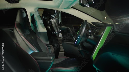 Wallpaper Mural Woman in black enter the car and put black suitcase on the seat in 4k Torontodigital.ca