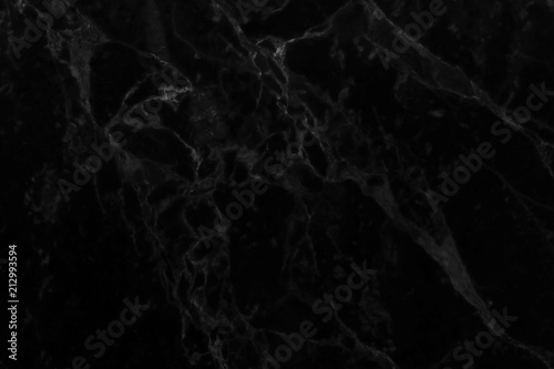 Abstract black marble background with natural motifs.