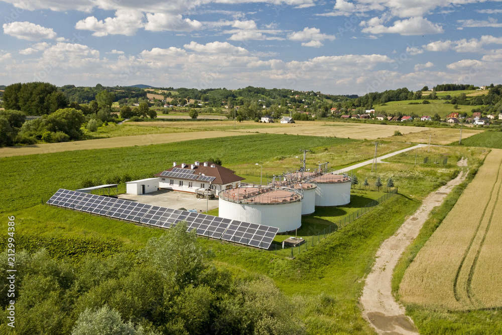A sewage treatment plant away from the city among the fields. Solar cells are accumulating free energy. Ecology of the use of natural resources. Panorama from a bird's eye view. Using a drone. A sewage treatment plant away from the city among the fields. Solar cells are accumulating free energy. Ecology of the use of natural resources. Panorama from a bird's eye view. Using a drone.