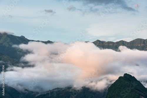 clouds twining round the green mountain