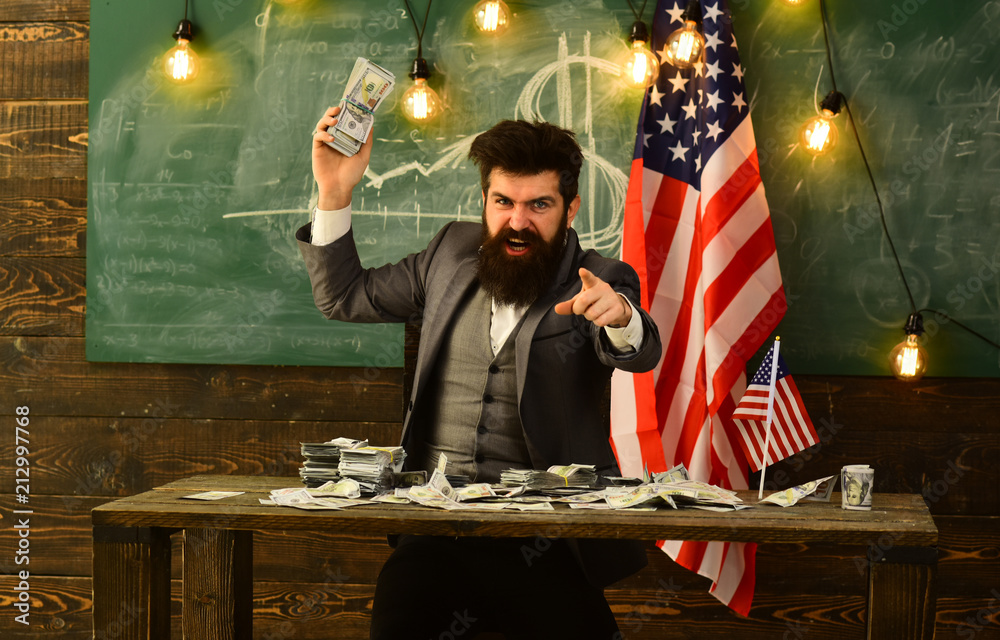man holding dollar bundles. money and american flag. Wealth and power. Income of successful politician man holding dollar bundles. money and american flag. Wealth and power. Income of successful politician