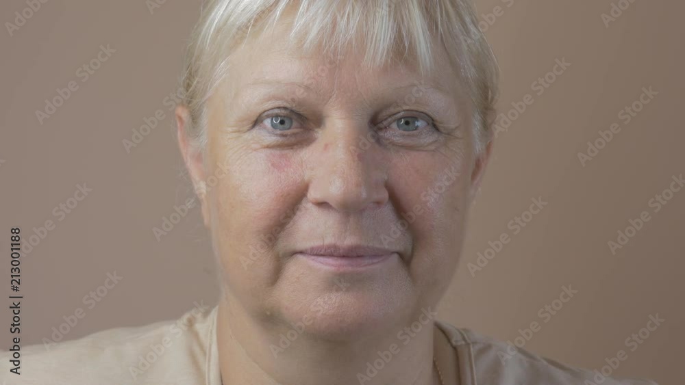 Middle aged woman looking at camera. Middle aged woman looking at camera.