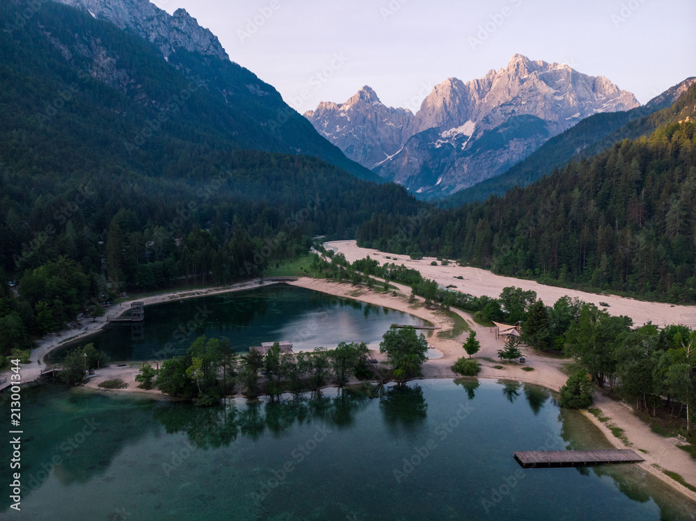 Aerial view over lake Jasna in Slovenia and Julian Alps