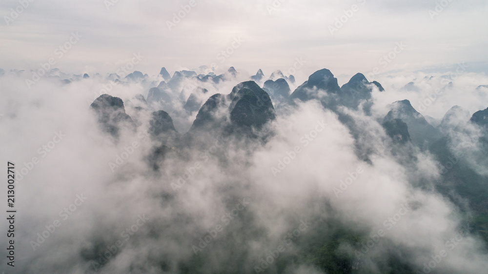 clouds twining round the green mountain