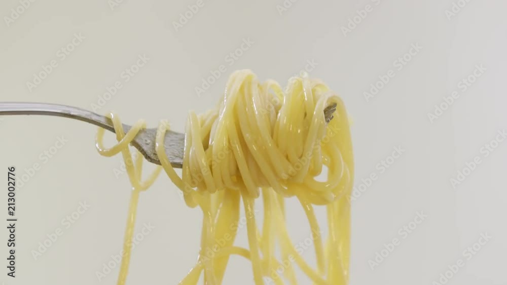 Eating pasta. Twirling spaghetti on a fork Stock Video Adobe Stock