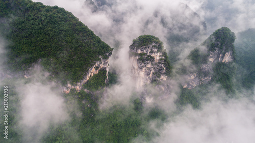 clouds twining round the green mountain