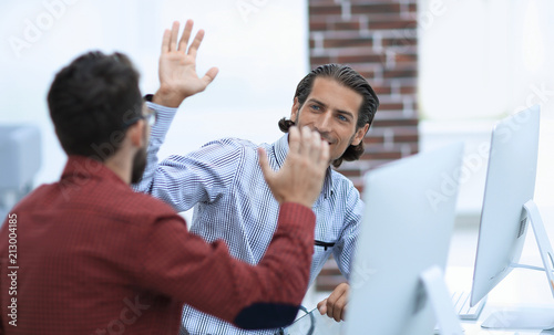 Businessman giving high five to his partner