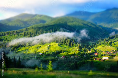 Beautiful sunny day is in mountain landscape. Beauty world. Tilt Shift blur effect.