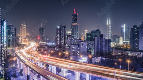 Wallpaper Mural aerial view of buildings and traffic multi-level junction at night in Shanghai city Torontodigital.ca