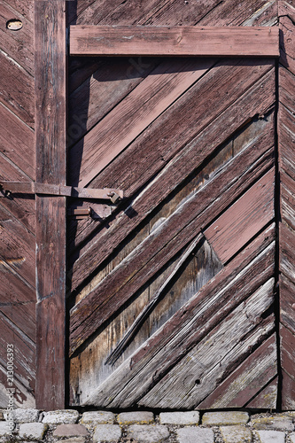 strongly weathered old wooden door close-up