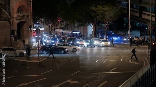 Traffic Crossing in Brisbane City at Intersection of Ann Street and Creek Street at Night photo