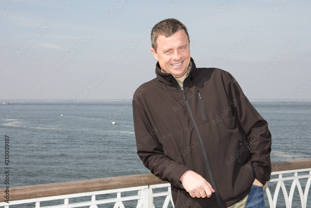 handsome man in vacation lake sea on background handsome man in vacation lake sea on background