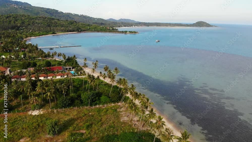 Aerial view of tropical sea and beach on white cloud and blue sky Aerial view of tropical sea and beach on white cloud and blue sky