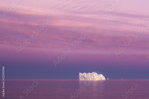 Iceberg at dusk, Qeqertarsuaq, Greenland, North America photo