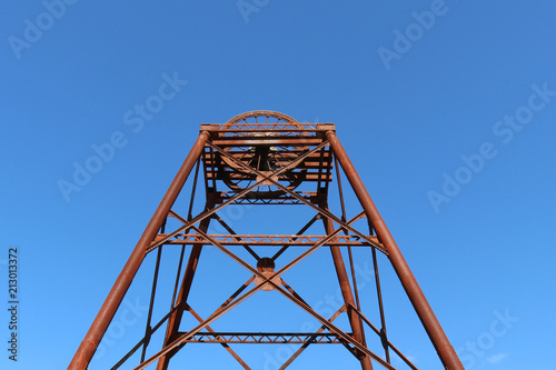 a rusty old poppet head structure left over from the gold mining days