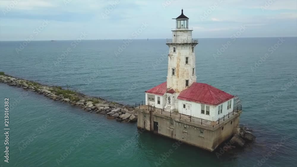 drone flies on a loop around light house to reveal city sky line drone flies on a loop around light house to reveal city sky line