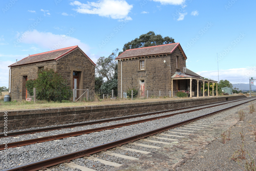 CARLSRUHE, AUSTRALIA - February 25, 2018: The Carlsruhe railway station and lamp room (1862), built of local bluestone with a slate roof, is now a private residence