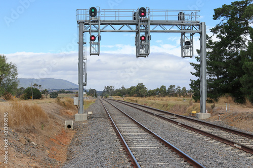 Foto a signal bridge and gantry at a country railway station in Australia