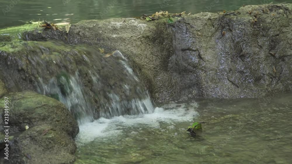 Natural landscape, view of the creek, small waterfall, rocky terrain.
Natural landscape, view of the creek, small waterfall, rocky terrain.