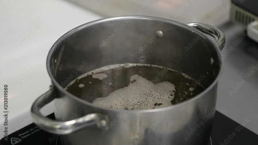 Japanese soup. Preparing ramen with soy sauce based soup.