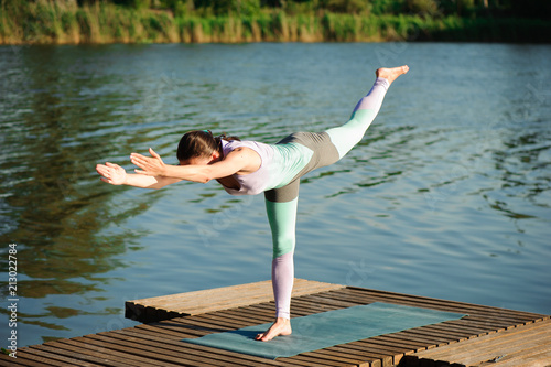 Young slim yoga woman making beautiful asana exercises. Healthy lifestyle. Stretching.