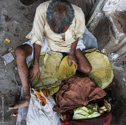 Homeless man with all his things on the street