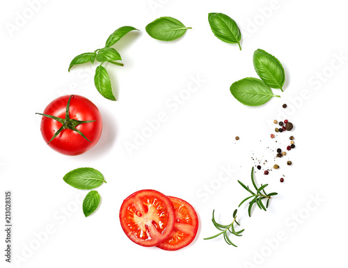 Ripe red tomatoes with basil, rosemary and pepper isolated on white background. Top view.
