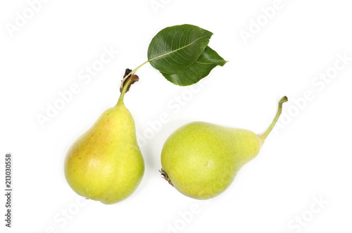 Fresh ripe pears with twig and leaf isolated on white background, top view