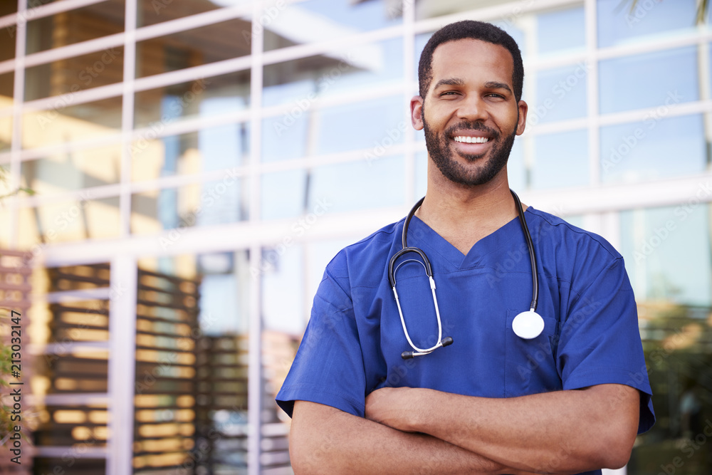 Young black male healthcare worker smiling outside, portrait - obrazy, fototapety, plakaty 