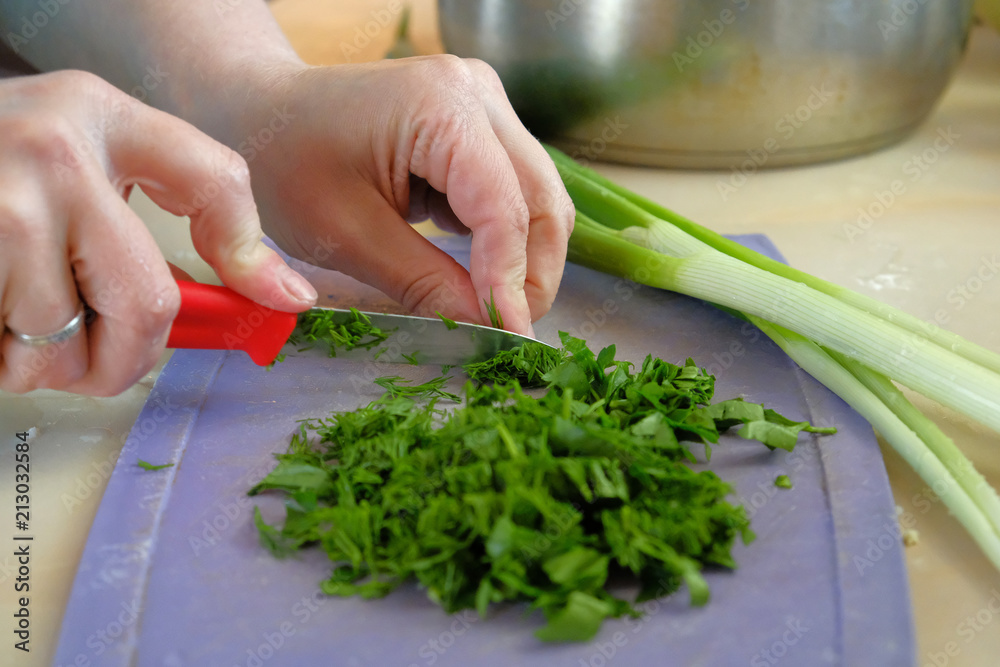 the chef cuts green salad the chef cuts green salad