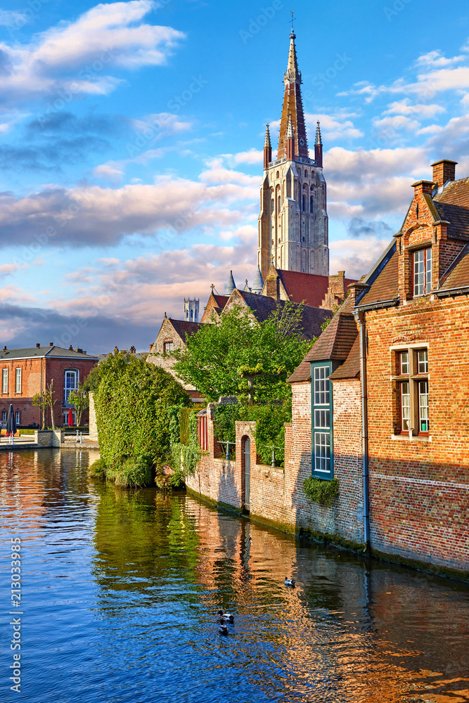 Bruges Belgium vintage stone houses and bridge over canal