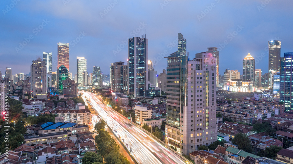 Obraz premium Aerial View of Yanan Rd, Jingan district, Shanghai in the evening on a cloudy day
