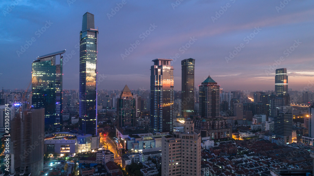 colorful reflection of dawn light on glass of buildings windows, Jingan district, Shanghai, China.
