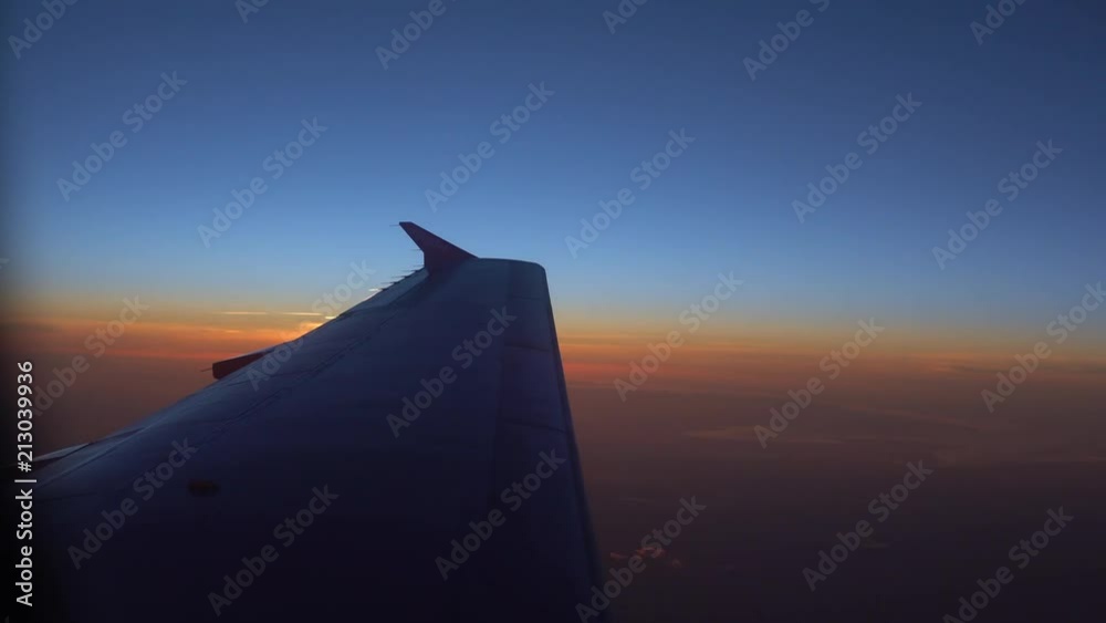 Gorgeous sunset flares over the left (port) wing of a jet, flying over Denmark. Gorgeous sunset flares over the left (port) wing of a jet, flying over Denmark.