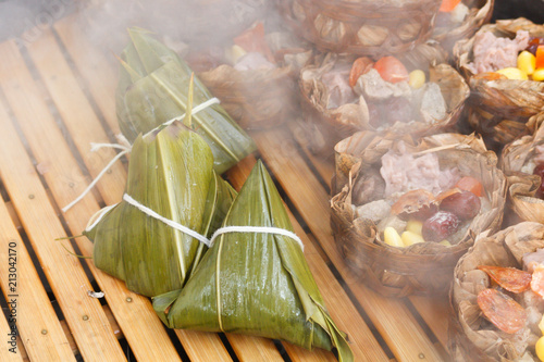 Rice Dumplings Steamed / Rice Dumplings Steamed On Bamboo For Dragon Boat Festival Rice Dumpling. photo