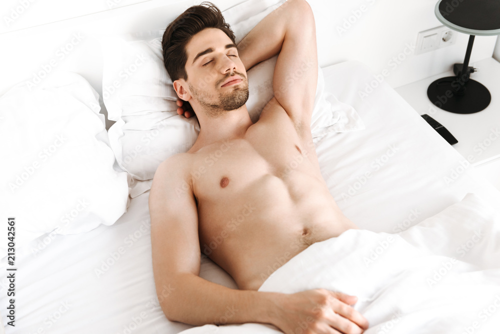 Handsome shirtless man sleeping in bed Stock Photo Adobe Stock