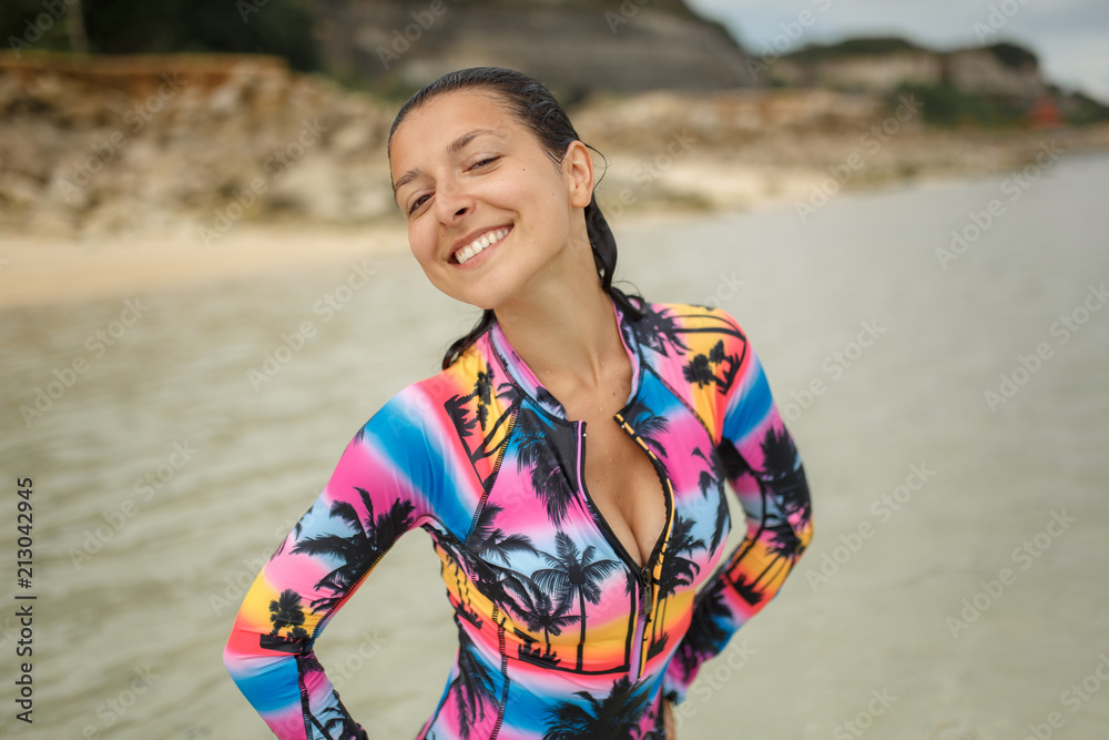 Young, sporty, sexy and beautiful girl in swimsuit resting on exotic beach in summer Young, sporty, sexy and beautiful girl in swimsuit resting on exotic beach in summer