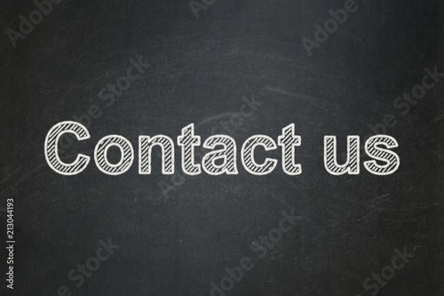 Finance concept: text Contact us on Black chalkboard background