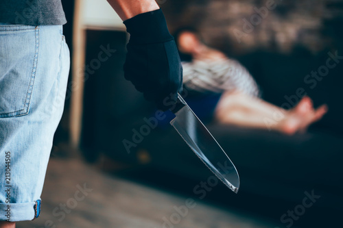 Wicked and evil murderer attempt to kill a woman in danger with a knife - homicide and violence society problem concept.
