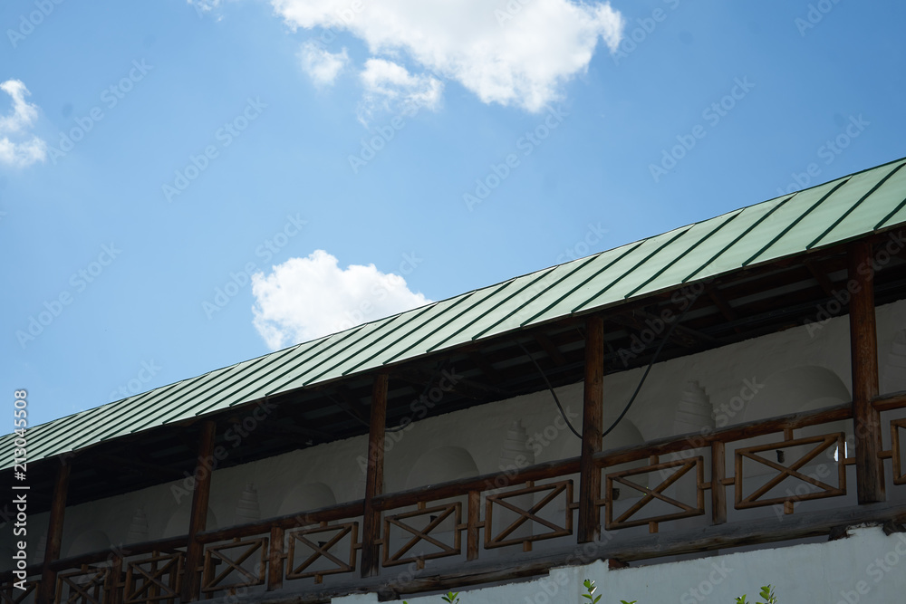 green roof on blue sky background